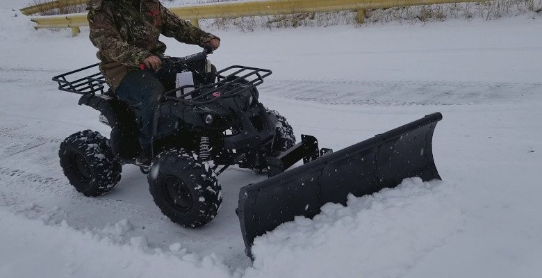 Plowing snow with ATV